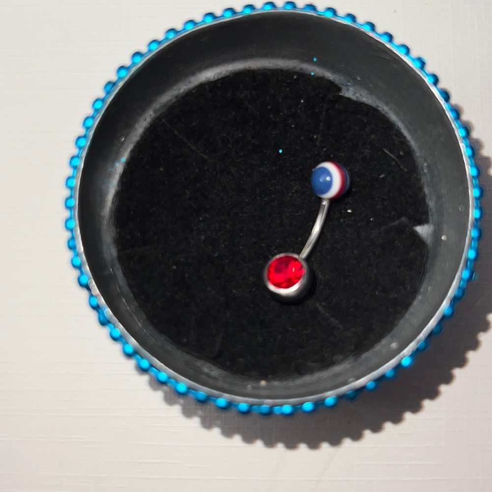 Belly ring with red white & blue striped top & red gemstone bottom